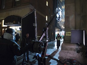 Crews work on a film set for a Titans TV series on a Toronto street on Wednesday April 17, 2019. (THE CANADIAN PRESS/Doug Ives)