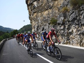 France's Thibaut Pinot (left), Denmark's Michael Morkov and cyclists ride during the 17th stage of the 106th edition of the Tour de France between Pont du Gard and Gap on July 24, 2019. (ANNE-CHRISTINE POUJOULAT/AFP/Getty Images)