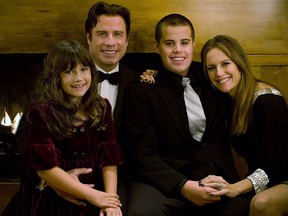 In this handout from Rogers and Cowan, John Travolta, his wife Kelly Preston  and their children Jett  and Ella pose in this undated picture. (Rogers and Cowan via Getty Images)