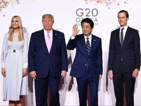 From left to right, adviser to the U.S. President Ivanka Trump, U.S. President Donald Trump, Japanese Prime Minister Shinzo Abe and U.S. Senior Adviser Jared Kushner attend the G20 Osaka Summit in Osaka, Japan, on June 28, 2019.