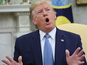 President Donald Trump talks with reporters while meeting with Pakistan’s Prime Minister Khan in the Oval Office of the White House in Washington, July 22, 2019. (REUTERS/Jonathan Ernst)