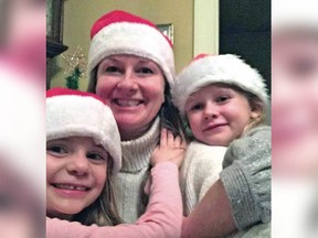 Four-year-old Aubrey Berry, left, Sarah Cotton and six-year-old Chloe Berry are shown celebrating Christmas together.