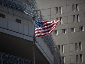 An American flag flies at the Metropolitan Detention Center prison as mass arrests by federal immigration authorities, as ordered by the Trump administration, were supposed to begin in major cities across the nation on July 14, 2019 in Los Angeles.