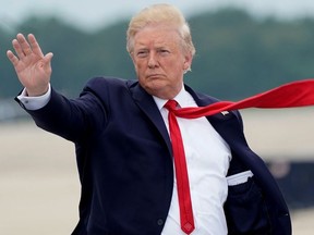 U.S. President Donald Trump boards Air Force One as he departs Washington for travel to Greenville, North Carolina at Joint Base Andrews, Maryland, U.S., July 17, 2019.