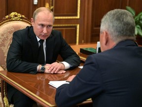 Russia's President Vladimir Putin meets with Defence Minister Sergei Shoigu to discuss a recent incident with a Russian deep-sea submersible, which caught fire in the area of the Barents Sea, in Moscow, Russia, on Tuesday, July 2, 2019.