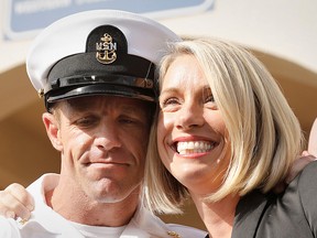 U.S. Navy SEAL Special Operations Chief Edward Gallagher, with wife Andrea Gallagher, celebrate after he was acquitted of most of the serious charges against him during his court-martial trial at Naval Base San Diego in San Diego, California , U.S.,  July 2, 2019.  (REUTERS/John Gastaldo)