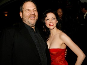 Producer Harvey Weinstein (L) and actress Rose McGowan arrive to the premiere of "Grindhouse" at the Orpheum Theatre on March 26, 2007, in Los Angeles.