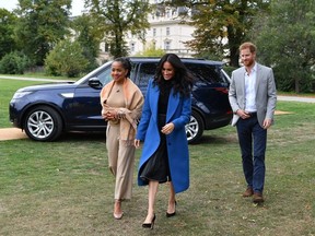 Meghan, Duchess of Sussex arrives with her mother Doria Ragland and Prince Harry, Duke of Sussex to host an event to mark the launch of a cookbook with recipes from a group of women affected by the Grenfell Tower fire at Kensington Palace on September 20, 2018 in London, England.