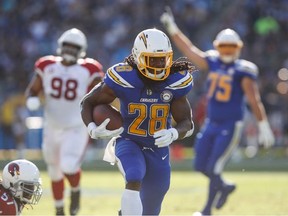 Running back Melvin Gordon of the Los Angeles Chargers makes a run play in the second quarter against the Arizona Cardinals at StubHub Center on November 25, 2018 in Carson, California.