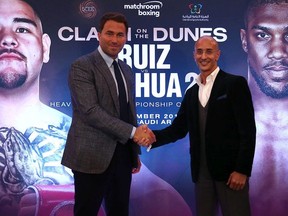 Eddie Hearn, managing director of Matchroom Sport and Omar Khalil, Managing Partner of Skill Challenge Entertainment, official event partner in The Kingdom of Saudi Arabia shake hands after a press conference to formally announce 'Clash on the Dunes' at The Savoy hotel on August 12, 2019 in London, England.