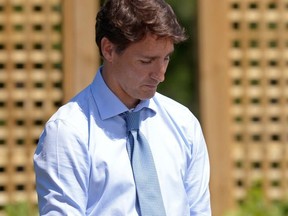 Prime Minister Justin Trudeau waits to be introduced before speaking about a watchdog's report that he breached ethics rules by trying to influence a corporate legal case regarding SNC-Lavalin, in Niagara-on-the-Lake, Ont., Aug. 14, 2019.