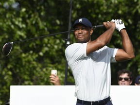 Tiger Woods hits his tee shot on the 17th hole during the first round of The Northern Trust golf tournament at Liberty National Golf Course, August 8, 2019. (Mark Konezny-USA TODAY Sports)