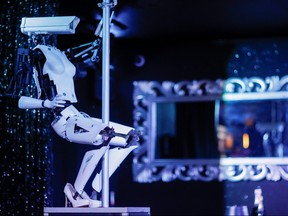 A pole-dancing robot created by British artist Giles Walker is displayed in the Strip Club Cafe in Nantes, France, August 29, 2019. REUTERS/Stephane Mahe