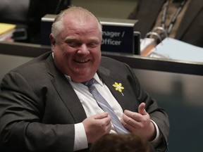 Then-mayor Rob Ford laughs during a vote at city council on April 3, 2014. (Craig Robertson/Toronto Sun)