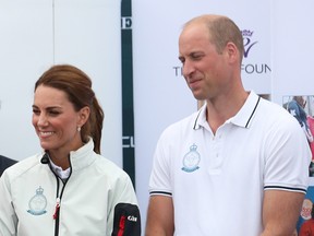Prince William and Catherine, the Duchess of Cambridge watch on as Bear Grylls is awarded the King's Cup during the prize giving following the the King's Cup Regatta in Cowes, the Isle of Wight, Britain August 8, 2019. (Andrew Matthews/REUTERS)