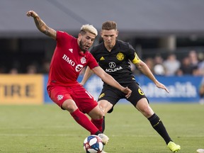 Toronto FC midfielder Alejandro Pozuelo (10) redirects the ball in front of Columbus Crew SC midfielder Wil Trapp (6) in the second half at MAPFRE Stadium on Saturday night. Mandatory Credit: Greg Bartram-USA TODAY Sports ORG XMIT: USATSI-401758