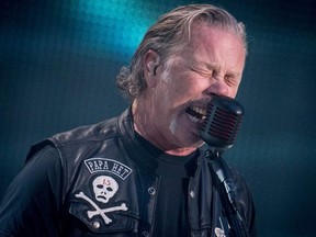 Guitarist James Hetfield of US rock band Metallica performs on stage during a concert at Parken Stadium, in Copenhagen, on July 11, 2019.