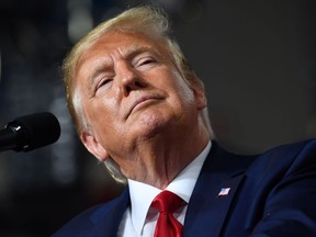 In this file photo taken on August 15, 2019, US President Donald Trump speaks during a "Keep America Great" campaign rally at the SNHU Arena in Manchester, New Hampshire.