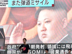 Footage of North Korea's leader Kim Jong Un is seen on a giant television screen in Tokyo on August 24, 2019, reporting on North Korea's missile launch earlier in the day. - North Korea on August 24 fired what appeared to be two short-range ballistic missiles  into the sea after vowing to remain the biggest "threat" to the United States and branding Secretary of State Mike Pompeo as "toxin."