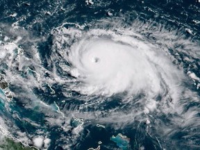 This satellite image obtained from NOAA/RAMMB, shows Tropical Storm Dorian as it approaching the Bahamas and Florida at 13:430UTC on August 31, 2019. - Dorian changed course slightly on Saturday, possibly putting it on track to hit the Carolinas rather than Florida as previously forecast, after a dangerous blast through the Bahamas. Meteorologists said Dorian has grown into an extremely dangerous Category 4 storm as it heads toward land.