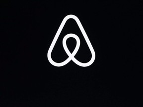 An Airbnb logo is pictured on Feb. 22, 2018, file photo shows a during an event in San Francisco.
