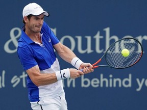 Andy Murray returns a shot against Richard Gasquet during the Western and Southern Open at Lindner Family Tennis Center in Mason, Ohio, on Monday, Aug. 12, 2019.