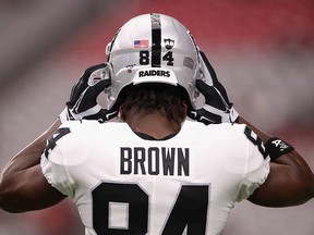 Wide receiver Antonio Brown of the Oakland Raiders adjusts his helmet before a  preseason game against the Arizona Cardinals at State Farm Stadium on August 15, 2019 in Glendale, Arizona. (Christian Petersen/Getty Images)