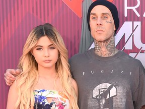 Alabama Barker and Travis Barker attend the 2019 iHeartRadio Music Awards which broadcasted live on FOX at Microsoft Theater on March 14, 2019, in Los Angeles.