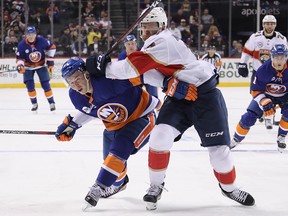 Michael Matheson of the Florida Panthers checks Anthony Beauvillier of the New York Islanders at the Barclays Center on October 24, 2018 in New York. (Bruce Bennett/Getty Images)
