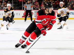 Ben Lovejoy of the New Jersey Devils skates with the puck against the Boston Bruins on November 22, 2017 at Prudential Center in Newark, N.J. (Elsa/Getty Images)