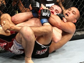 BJ Penn (right) grapples with Jon Fitch during their UFC 127 welterweight bout at Acer Arena on February 27, 2011 in Sydney, Australia. (Josh Hedges/Zuffa LLC/Zuffa LLC via Getty Images)