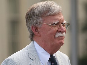 U.S. National Security Adviser John Bolton walks to give an interview to Fox News outside of the White House in Washington, D.C., July 31, 2019.