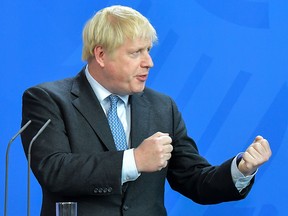 In this file photo taken on August 21, 2019 British Prime Minister Boris Johnson speaks to journalists with the German Chancellor at the Chancellery in Berlin. (TOBIAS SCHWARZ/AFP/Getty Images)
