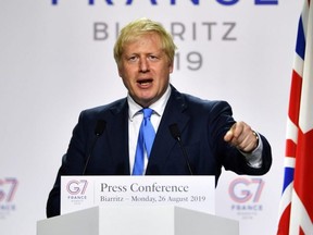 Britain's Prime Minister Boris Johnson speaks during a news conference at the end of the G7 summit in Biarritz, France, on Monday, Aug. 26, 2019.