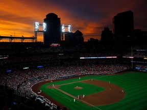 The sun sets over Busch Stadium in the fourth inning of a game between the St. Louis Cardinals and Milwaukee Brewers in St Louis on Tuesday, Aug. 20, 2019.
