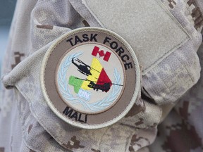 The UN Mali patch is shown on a Canadian forces member's uniform before boarding a plane at CFB Trenton in Trenton, Ont., on Thursday July 5, 2018.