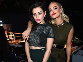 Charli XCX (L) and Rita Ora pose backstage at iHeartRadio Jingle Ball 2014, hosted by Z100 New York and presented by Goldfish Puffs at Madison Square Garden on Dec. 12, 2014, in New York City.