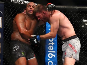 Stipe Miocic grapples with Daniel Cormier during their UFC 241 heavyweight title bout at Honda Center on August 17, 2019 in Anaheim. (Joe Scarnici/Getty Images)