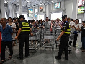 People visit the first Costco outlet in China, on the stores opening day in Shanghai on August 27, 2019. (HECTOR RETAMAL/AFP/Getty Images)