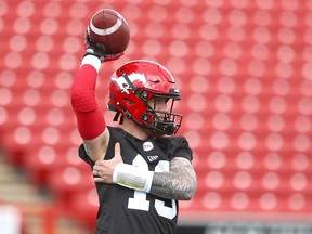 QB Bo Levi Mitchell stretches during the first session of Calgary Stampeders CFL training camp in Calgary Sunday, May 19, 2019.