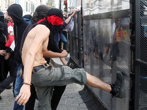 Demonstrators attack the police blockade during a protest against G7 summit, in Bayonne, France, August 24, 2019. (REUTERS/Sergio Perez)