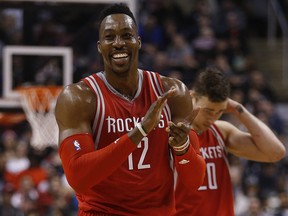 Houston Rockets’ Dwight Howard (12) laughs at the refs after receiving a flagrant foul against the Raptors in Toronto on March 6, 2016. (Jack Boland/Postmedia Network)