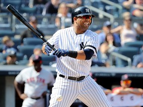 Edwin Encarnacion of the New York Yankees reacts after getting hit by a pitch in the eighth inning against the Boston Red Sox during game one of a double header at Yankee Stadium on Aug. 3, 2019, in the Bronx borough of New York City.