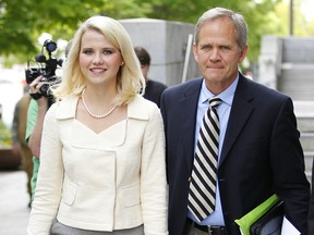 Elizabeth Smart walks out of federal court with her father Ed Smart after a hearing for the sentencing of her kidnapper Brian David Mitchell May 25, 2011 in Salt Lake City, Utah. (George Frey/Getty Images)