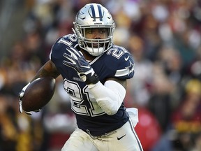 Running back Ezekiel Elliott of the Dallas Cowboys carries the ball against the Washington Redskins at FedExField on October 21, 2018 in Landover, Maryland. (Patrick McDermott/Getty Images)