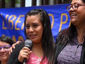 Salvadorean rape victim Evelyn Hernandez speaks after being cleared of murder after giving birth to a stillborn baby at home in 2016, outside Ciudad Delgado's court in San Salvador on Monday, Aug. 19, 2019.