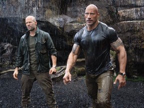 Dwayne Johnson, right, and Jason Statham are mismatched partners in the action spinoff "Fast & Furious Presents: Hobbs & Shaw." (Handout courtesy of Daniel Smith/Universal Pictures)