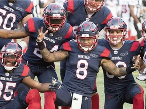 Alouettes quarterback Vernon Adams Jr., (8) celebrates with teammates after scoring a touchdown during first half CFL football action against the Ottawa Redblacks in Montreal, Friday, August 2, 2019.