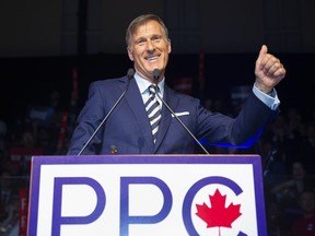 Maxime Bernier, leader of the People's Party of Canada, raises his thumb at the launch of his campaign Sunday, August 25, 2019 in Sainte-Marie Que.