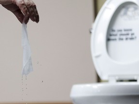 A wipe is tested in Middlesex, N.J., Friday, Sept. 20, 2013. The Competition Bureau of Canada is investigating the marketing practices of companies that make so-called "flushable" wipes.